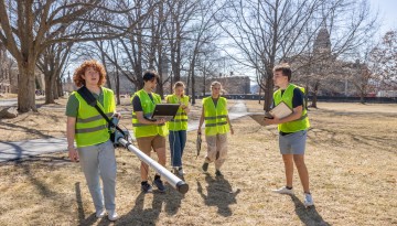 Students conduct field work on the Arts Quad.
